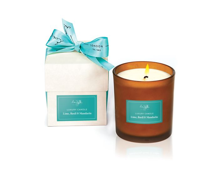 Eve Taylor Limited Edition Lime, Basil and Mandarin Candle in an amber glass jar with gift packaging