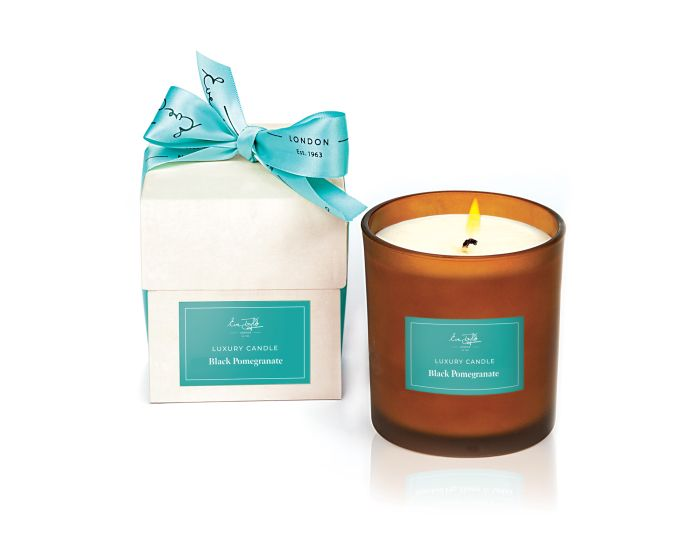 Eve Taylor Limited Edition Black Pomegranate Candle in an amber glass jar with gift packaging